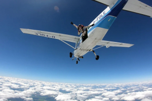 Skydiver exit the Cessna